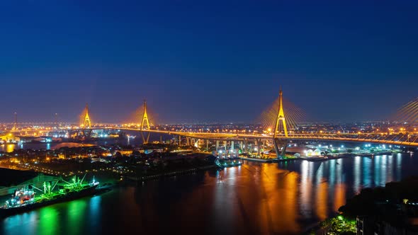 night to day time lapse of Bhumibol suspension bridge cross over Chao Phraya River in Bangkok