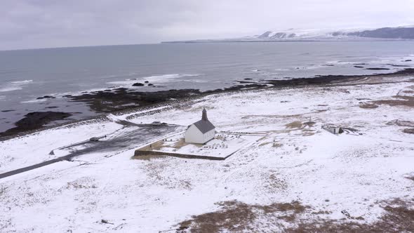 Secluded Church in Snowy Iceland on the Coast alt