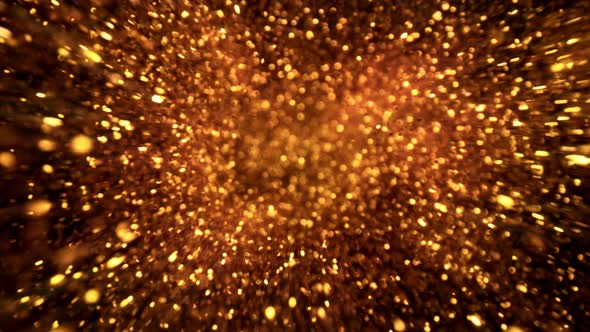 Super Slow Motion Shot of Golden Glittering Particle Background at 1000 Fps alt