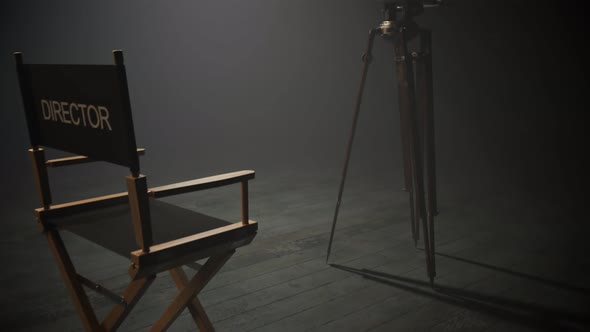 Director chair and retro video camera in a dense fog. Climatic, moody atmosphere