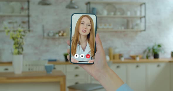 Woman Checks Possible Symptoms with Professional Physician, Using Online Video Chat. Young Girl Sick alt