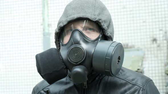 Man in Gas Mask at Epidemic Standing Outdoors