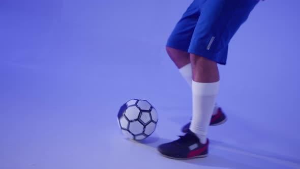 Professional Football Player Chasing Ball with Feet Closeup alt