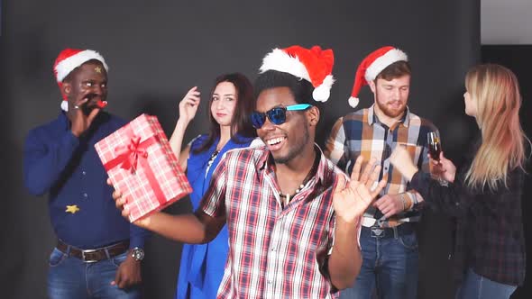 Mixed Race Group of Young People at Christmas Party. Slow Motion