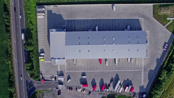 Buildings of Logistics Center Warehouses Near the Highway alt