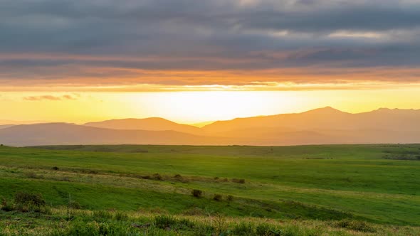 Panorama of a fabulous sunset in a mountainous area with low-lying clouds alt