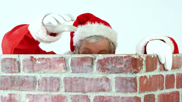 Santa claus climbing up a chimney alt