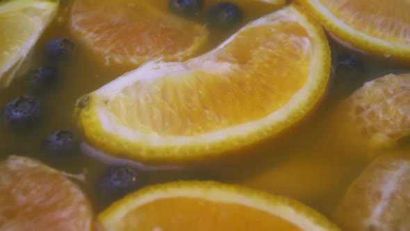 Smoky Cocktail with Blueberry and Orange Slices