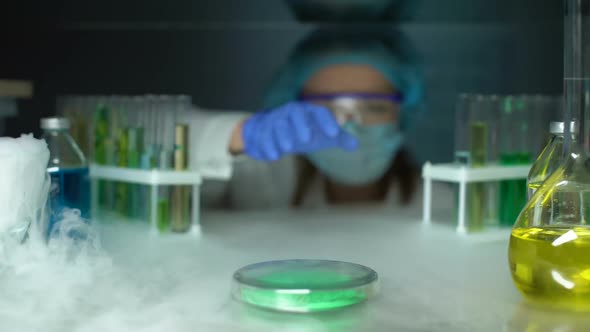 Lab Assistant Taking Green Powder From Fridge, Dermatology Cryotherapy Material alt