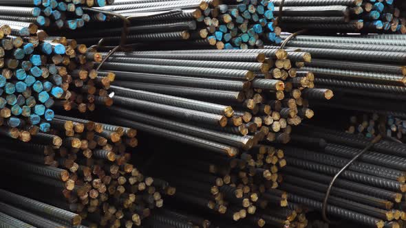 A pile of construction metal fittings on a construction site in close-up alt