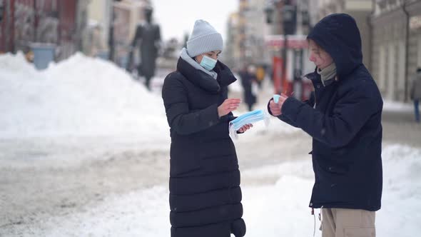 Volunteers Give People Free Medical Face Masks To Protect Against the Virus alt