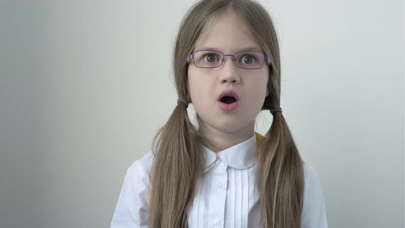Surprised Schoolgirl with School Bag in White School Blouse and Glasses alt