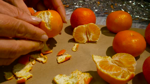 Female Hands Brushing Tangerine