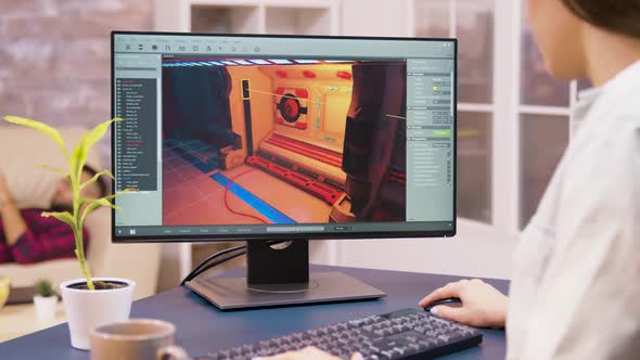 Close Up Shot of Young Woman Game Developer Working on a New Video Game Level alt