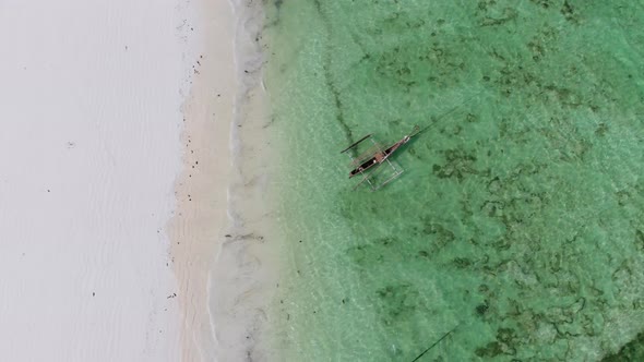 Boats Anchored Off the Coast on Shallow Ocean at Low Tide Aerial Top Zanzibar alt