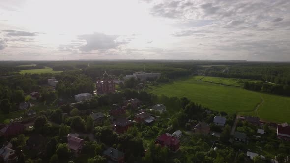 Aerial Scene of Village with Ascension Cathedral in Lukino, Russia alt