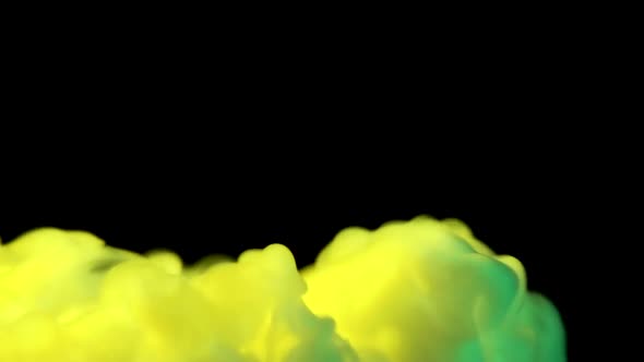 Yellow and Green Smoke Dry Ice on a Black Background with Copy Space. Closeup. Slow Motion alt