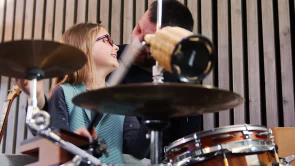 Father and Daughter Play Percussion Together