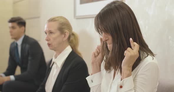 Young Stressed Caucasian Woman Crossing Fingers Before Job Interview. Nervous Beautiful Female alt