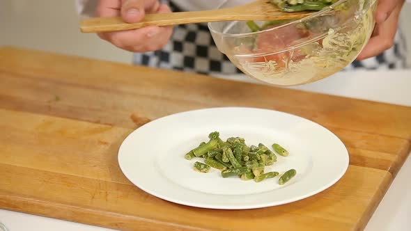Cooking Warm Salad with Green Beans and Salami Slices alt
