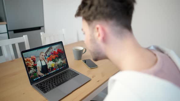 Man on Selfisolation Chooses Flowers As a Gift Online the Process of Making a Gift Purchase Using alt
