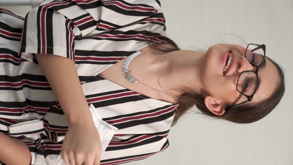 Vertical Video of Young Woman Take Off Face Mask Removing From Face alt