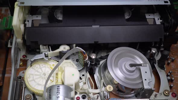 Closeup a VHS Video Cassette Recorder Tape Loading alt