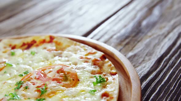 Baked pizza with cherry tomato toppings alt