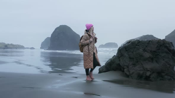 Aerial Drone Shot Beautiful Relaxed Woman Walking By Wet Ocean Beach Oregon alt