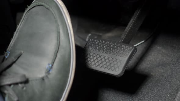 Car foot pedal. Accelerator and break pedal in a car. Close up the foot pressing foot pedal of a car