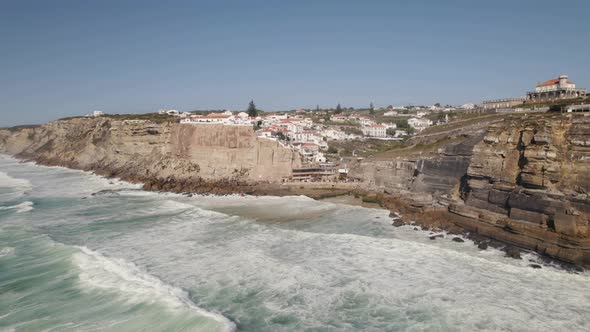 Long powerful waves washing on rocky coast and cliffs, Azenhas do Mar, Portugal. alt