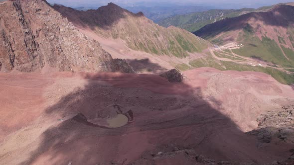 A Moraine Lake Among a Glacier Covered with Rocks alt