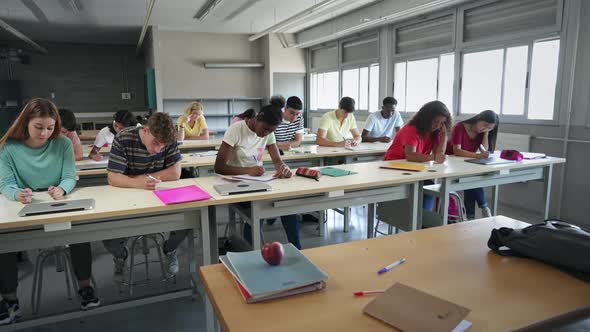 Teenager Students Taking Exam at College Preparation Course for University alt