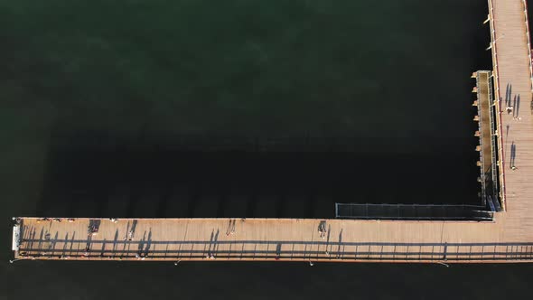 Top View Tourists Walking On Pier In Lithuania alt