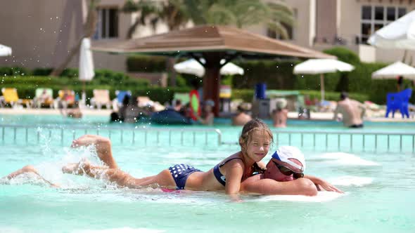 Man in Sun Glasses Father and Daughter Kid Girl Playing in the Pool Water Having Fun Together alt