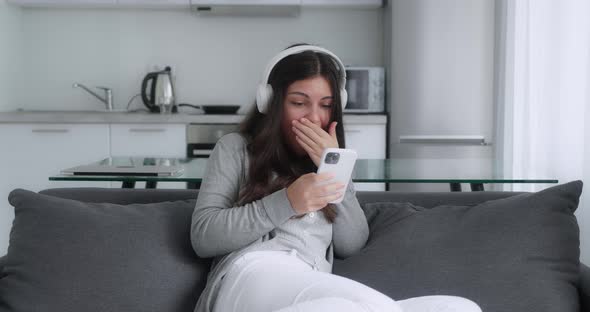 Funny Brunette Young Woman Customer Celebrating Winning Bid or Getting Ecommerce Shopping Offer on alt