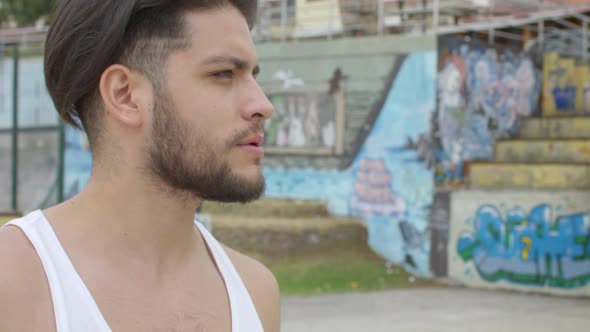 handsome man drinking clean water from plastic bottle alt