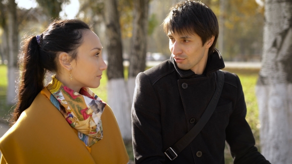 The Guy With The Girl At Lunchtime Walk On The Alley In The City Center. They Have a Great Time alt