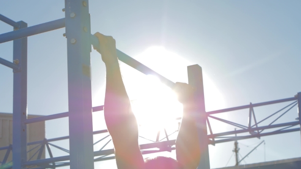 Pulling Up On The Bar, Man Doing Push-ups On The Horizontal Bar alt