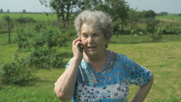 Old Woman 80s Tells On The Mobile Phone