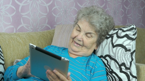 Elderly Woman With a Tablet Computer