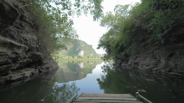 Boat Sailing Among Limestone Mountains In Ha Long Bay, Vietnam alt