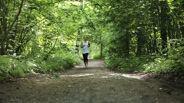Girl Runs On The Road In a Field. alt