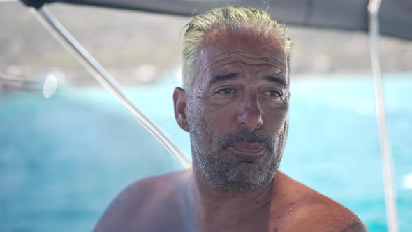 Headshot Portrait of Positive Confident Man Talking in Slow Motion Standing at Steering Wheel on alt