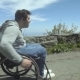 Man on Wheelchair in the Mountains - VideoHive Item for Sale