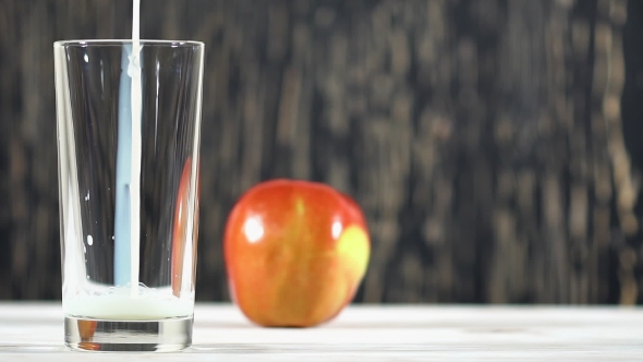 Pouring Milk Into Glass.