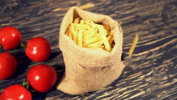 Tomato And Pasta On Wooden Background