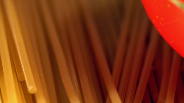 Tomato and Pasta on Wooden Background