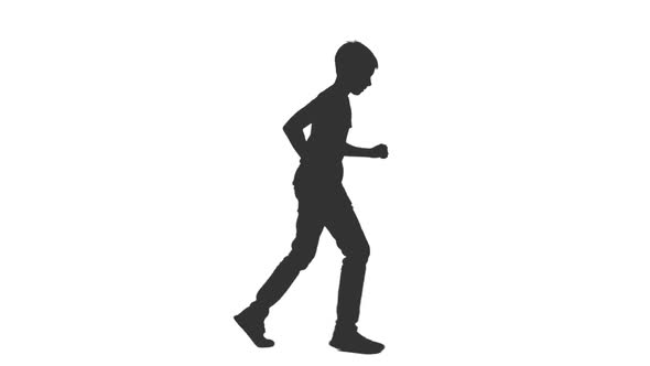 Silhouette of Running Teenage Boy in Casual Wear