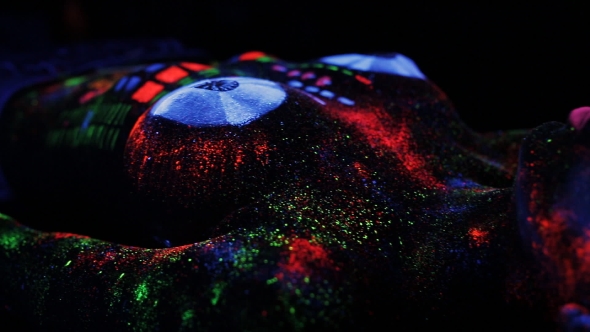 Topless Girl Painted In UV Powder As a DJ Panel. alt